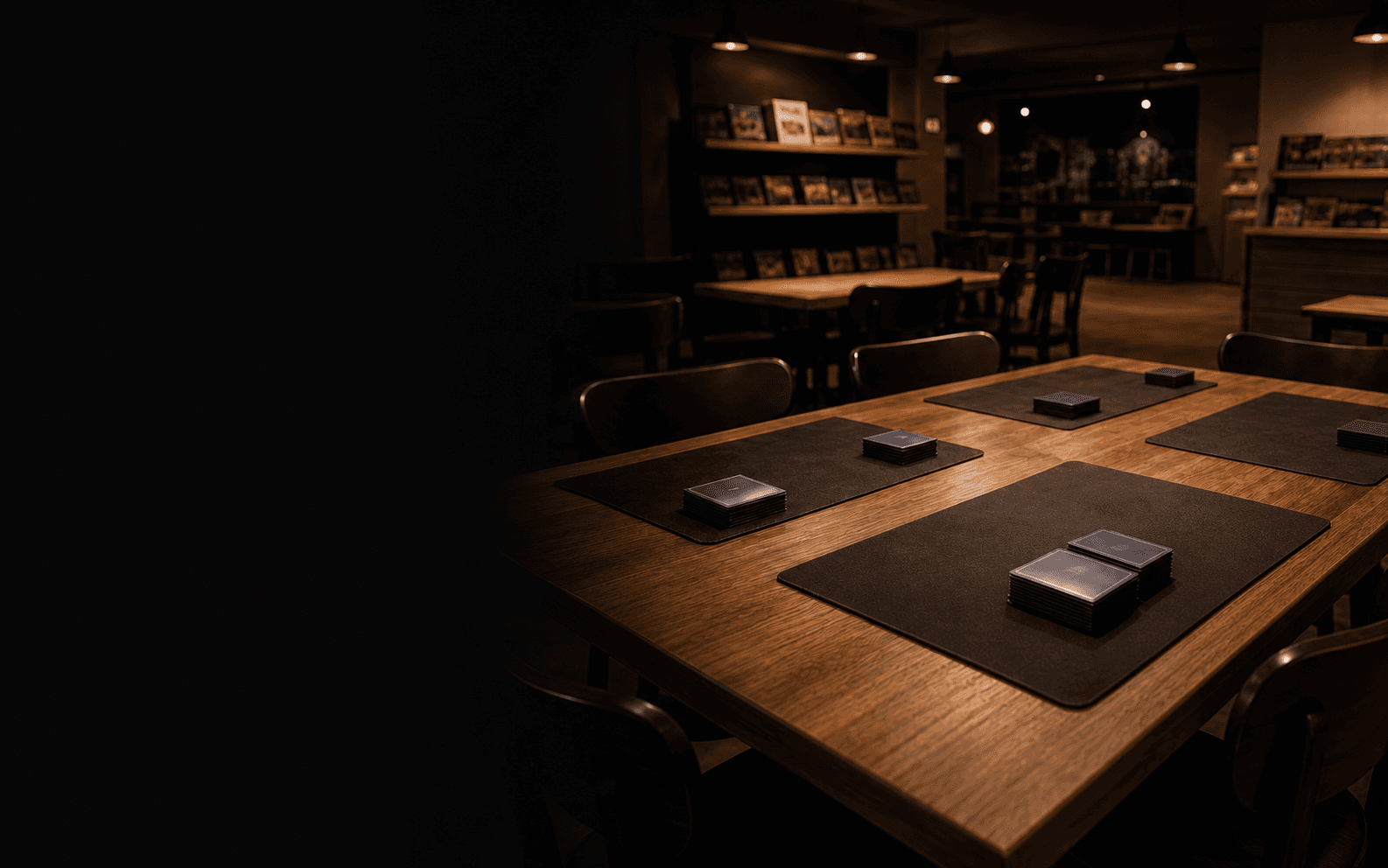 An empty public-venue table prepared for recurring tabletop play